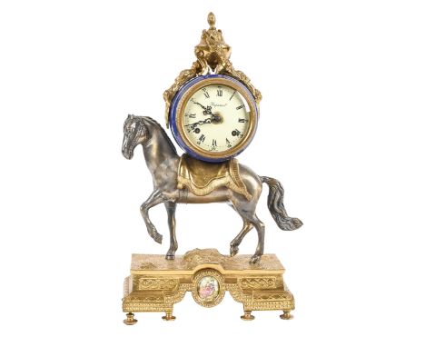 An Italian giltmetal and spelter mantel clock, in Louis XVI style, with painted enamel dial, 43cm h; 26cm w, with key  