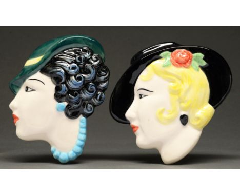 Two slip cast earthenware wall heads, each as a stylish young woman in a hat, in Art Deco style, 18cm  Good condition