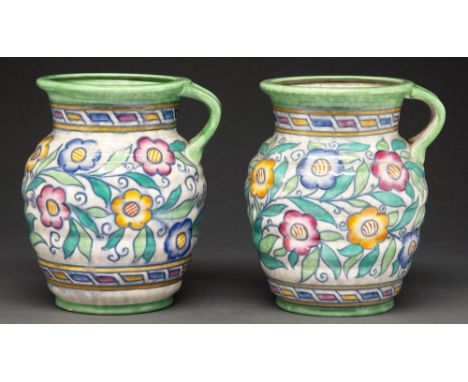 Charlotte Rhead. A pair of Crown Ducal tube lined Caliph pattern jugs, 1937-1939, 21cm h, printed mark and facsimile signatur