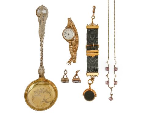 A 9ct gold and onyx watch fob swivel, Birmingham 1919, on 9ct gold mounted black moire silk fob, a 9ct gold lady's wristwatch