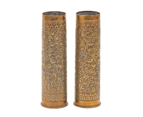 Trench art. A pair of British WWII brass shell cases adapted as spill vases and chased with flowers and foliage, early 20th c