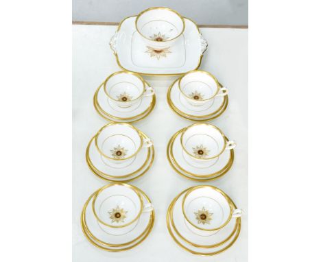 A Royal Crown Derby bone china Star of Eden tea service, comprising six teacups, saucers and side plates, sugar bowl and serv