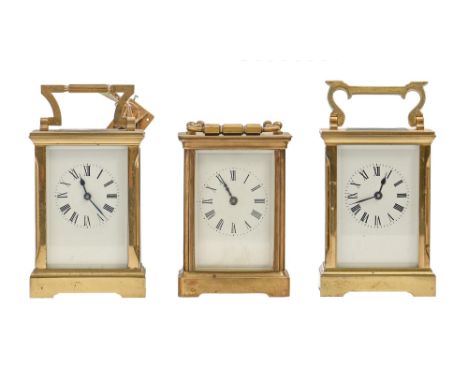 A French brass carriage timepiece,&nbsp;with platform lever escapement, 12cm h excluding handle and two others similar  One c