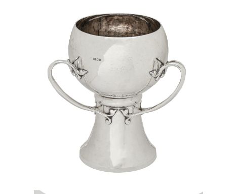 A George V Art Nouveau silver cup, the ovoid bowl with three bifurcated handles on flared foot, hammer textured, 26.5cm h, by