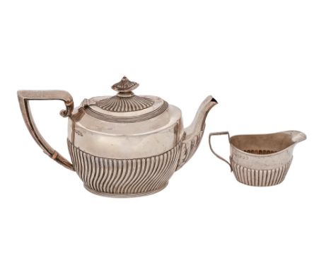 A Victorian silver teapot, the handle with ivory insulators, 12.5cm h, maker's mark rubbed, Chester 1894 and a matching silve