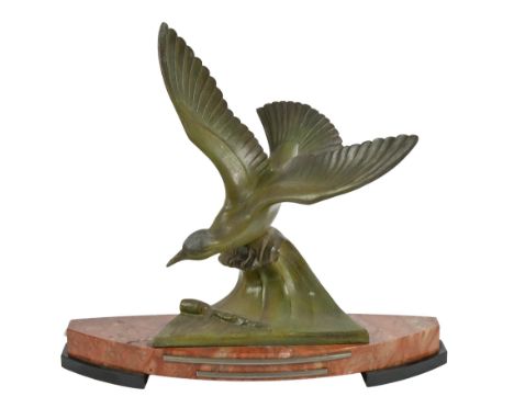 An Art Deco bronzed spelter sculpture of a seabird in flight, on marble base, 41cm h; 46cm w  