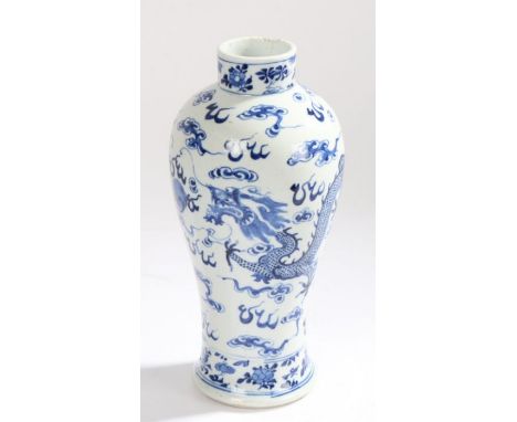 Chinese porcelain vase, Kangxi four character mark but later, the blue and white glazed baluster body with two dragons among 