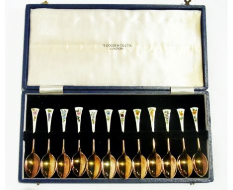 Set of late 20th century silver-gilt and enamel teaspoons, each terminal of engine-turned cream enamel decoration, handpainte