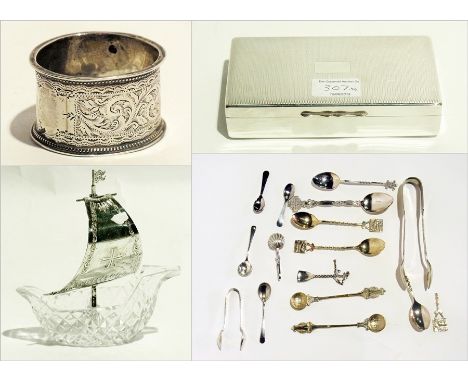 An Edwardian silver napkin ring, a cut glass boat-shaped bowl with white metal sail, a silver plate rectangular cigarette box