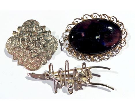 Modern silver abstract brooch, silver-coloured metal engraved brooch and a silver and purple ceramic stone brooch 