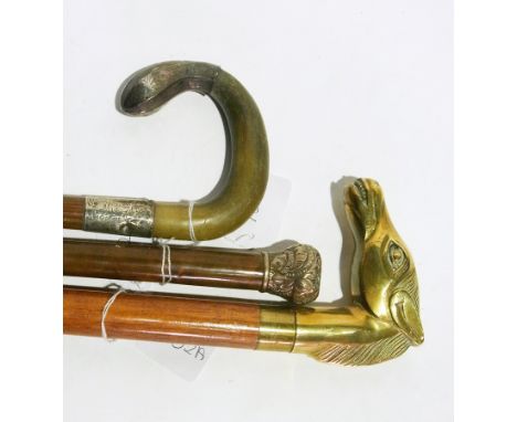 Three walking sticks, one with bone and silver handle and a brass-mounted handle of a horse's head and a silver mounted bambo