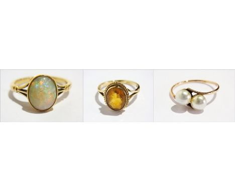 18ct gold opal ring, 9ct gold yellow stone set ring and another ring set faux pearls 