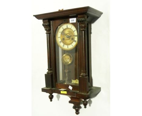 Vienna regulator wall clock with broken arch pediment, with ceramic chapter ring, striking movement supported by turned colum