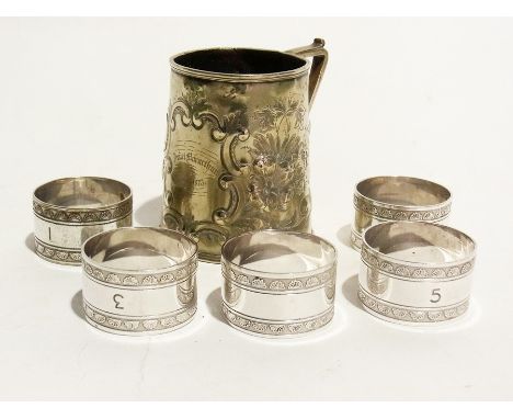 A set of six silver plate teaspoons, five silver plate napkin rings, a George VI coronation caddy spoon, two nutcrackers, fiv