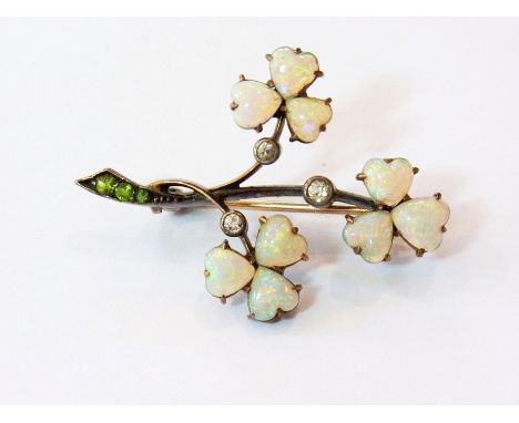 Gold, opal, diamond and green stone shamrock brooch, the three shamrocks set heart-shaped opals, three small diamonds and thr