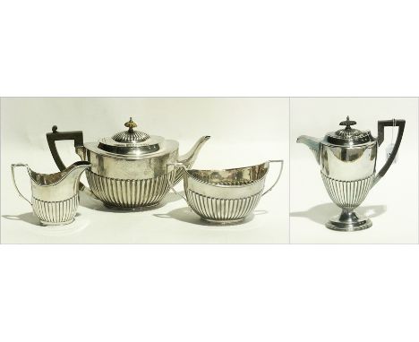 Georgian style Edwardian matched silver four-piece tea service, semi-gadrooned and oval, Birmingham 1907 and Sheffield 1905, 