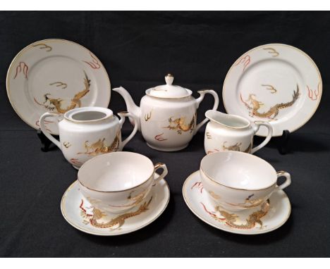 JAPANESE EXPORT WARE TEA SETcomprising six cups and saucers, six side plates, lidded tea pot, milk jug and sugar bowl (22) 