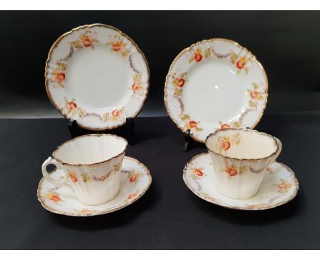 ROYAL ALBERT TEA SERVICEdecorated with poppies and gilt highlights, comprising eight cups and saucers and eight side plates (