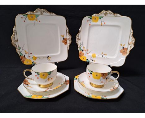 PARAGON TEA SETthe white ground decorated with flowers and gilt highlights, comprising five cups, seven saucers, seven side p