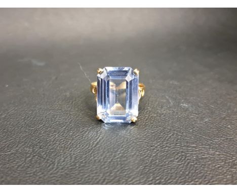 BLUE TOPAZ DRESS RINGthe rectangular step cut topaz measuring approximately 17.8mm x 13mm x 7.2mm, on nine carat gold shank, 