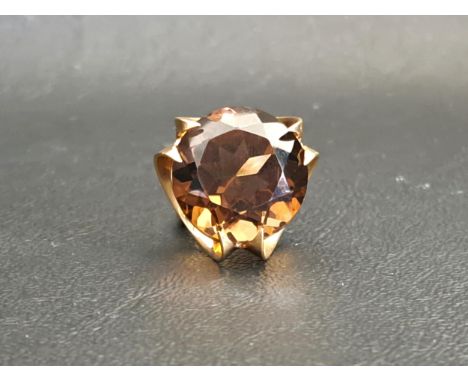 LARGE SMOKY QUARTZ SINGLE STONE DRESS RINGthe round cut quartz measuring approximately 17.5mm x 17.5mm x 11.8mm, on nine cara