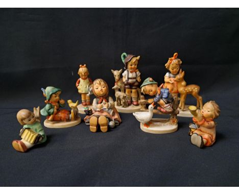 EIGHT GOEBEL FIGURINEScomprising Little goat herder, 13.5cm high, Girl with deer, 13cm high, Boy with goose, 9cm high, Happy 