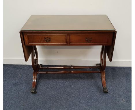 MAHOGANY SOFA TABLEwith two frieze drawers and two opposing dummy drawers, standing on lyre end supports with reeded legs and