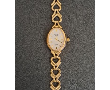 LADIES ROTARY NINE CARAT GOLD CASED WRISTWATCHwith white enamel dial with baton five minute markers, on nine carat gold brace