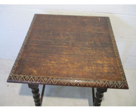 An oak occasional table with bobbin turned legs