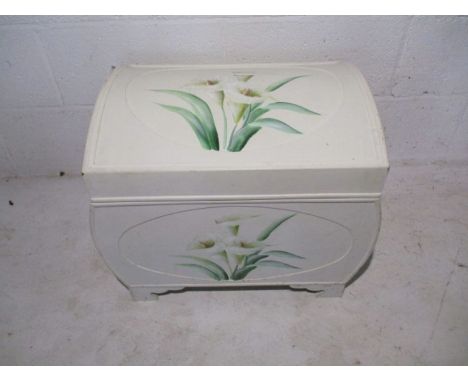 A small white painted wooden trunk depicting lily's 