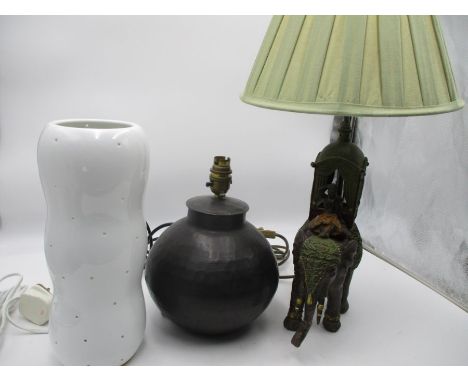 A lamp in the form of a ceremonial elephant, trunk A/F.  A hammered brass lamp base plus an Ikea lamp. 