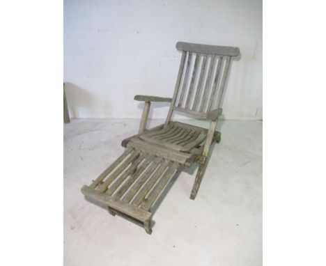 A teak steamer chair. 