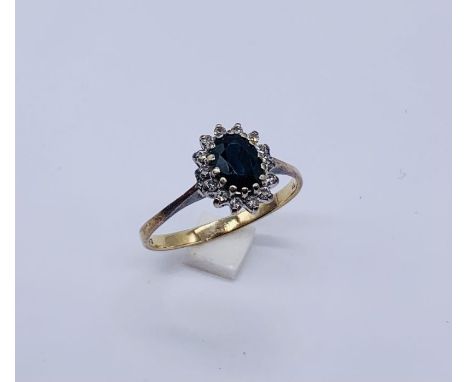 A 9ct gold diamond and sapphire cluster ring