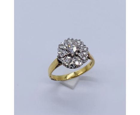 An 18ct gold diamond cluster ring