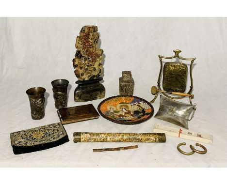 A collection of Eastern and Oriental items including soapstone carving, SCM purse, table gong, brass cups with dragon decorat