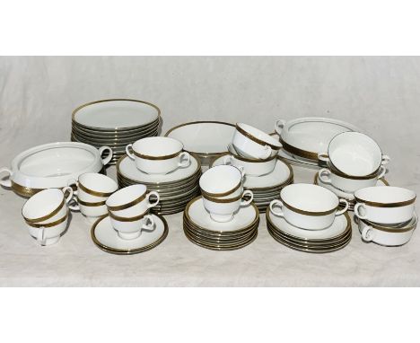 An Eschenbach part dinner service with gilt detail, to include 8 cups and saucer, 8 soup bowls, terrines, dinner plates, side