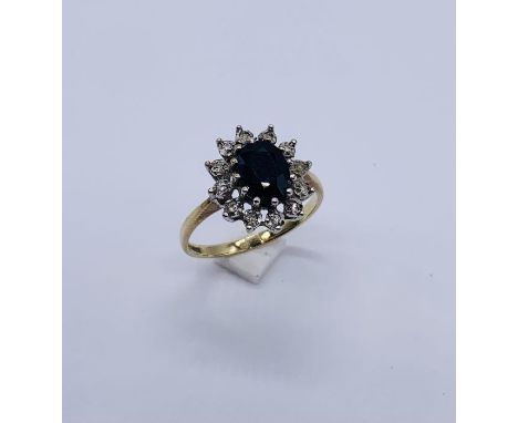 A 9ct gold diamond and sapphire cluster ring