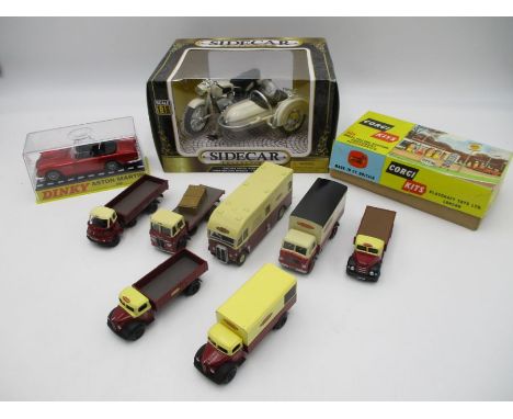 A collection of seven die-cast British Railways vehicles, along with a boxed diecast Toyway Sidecar, cased Dinky Aston Martin