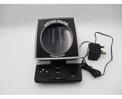 A vintage Grandstand Astro Wars arcade style table top game with power cable