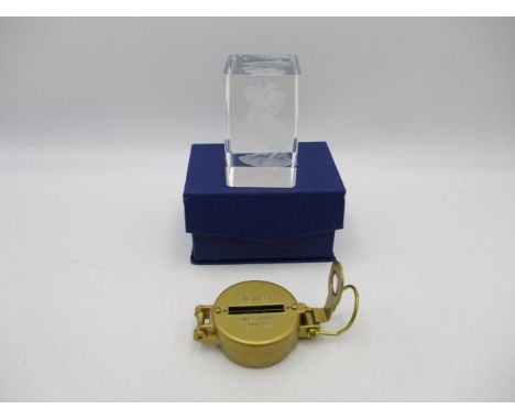 An engineer's directional compass, along with boxed glass paperweight depicting Napoleon on a horse  