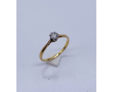 A diamond solitaire ring set in 18ct gold