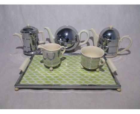 A vintage five piece Art Deco ceramic tea set with insulating chrome jackets on tray