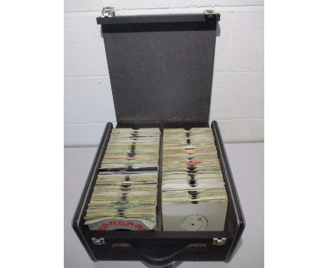 A large carry case full of 7" vinyl singles including Queen, Robert Plant, The Police, The Pretenders, Prince, The Stranglers