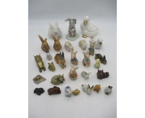 A collection of mainly ceramic rabbits and ducks