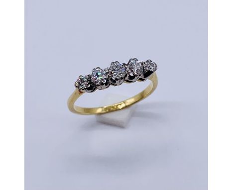 An 18ct gold and platinum diamond five stone ring