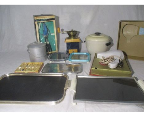 An assortment of vintage kitchen ware including a Prestige egg beater, coffee grinder, set of silver plated spoons, three tra