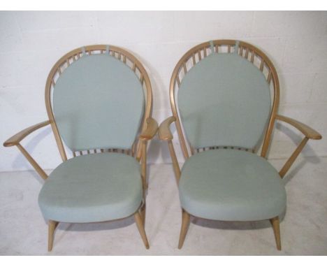 A pair of Ercol Winsor stick back armchairs. 