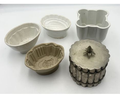 A collection of ceramic and metal vintage jelly moulds 