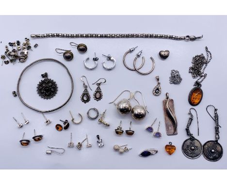 A collection of 925 silver earrings, bangle, pendants etc.