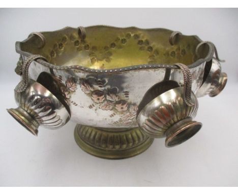 A silver plated punch bowl with six cups